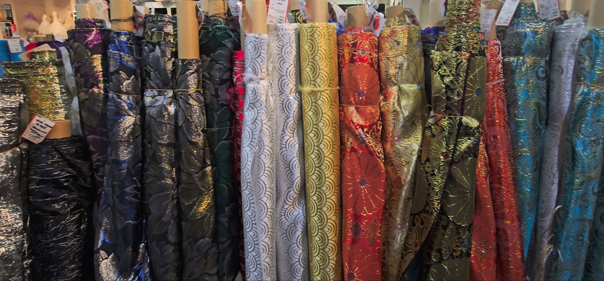 Rolls of bright fabric